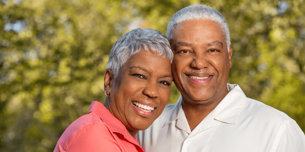 Happy and healthy senior couple embrace and smile