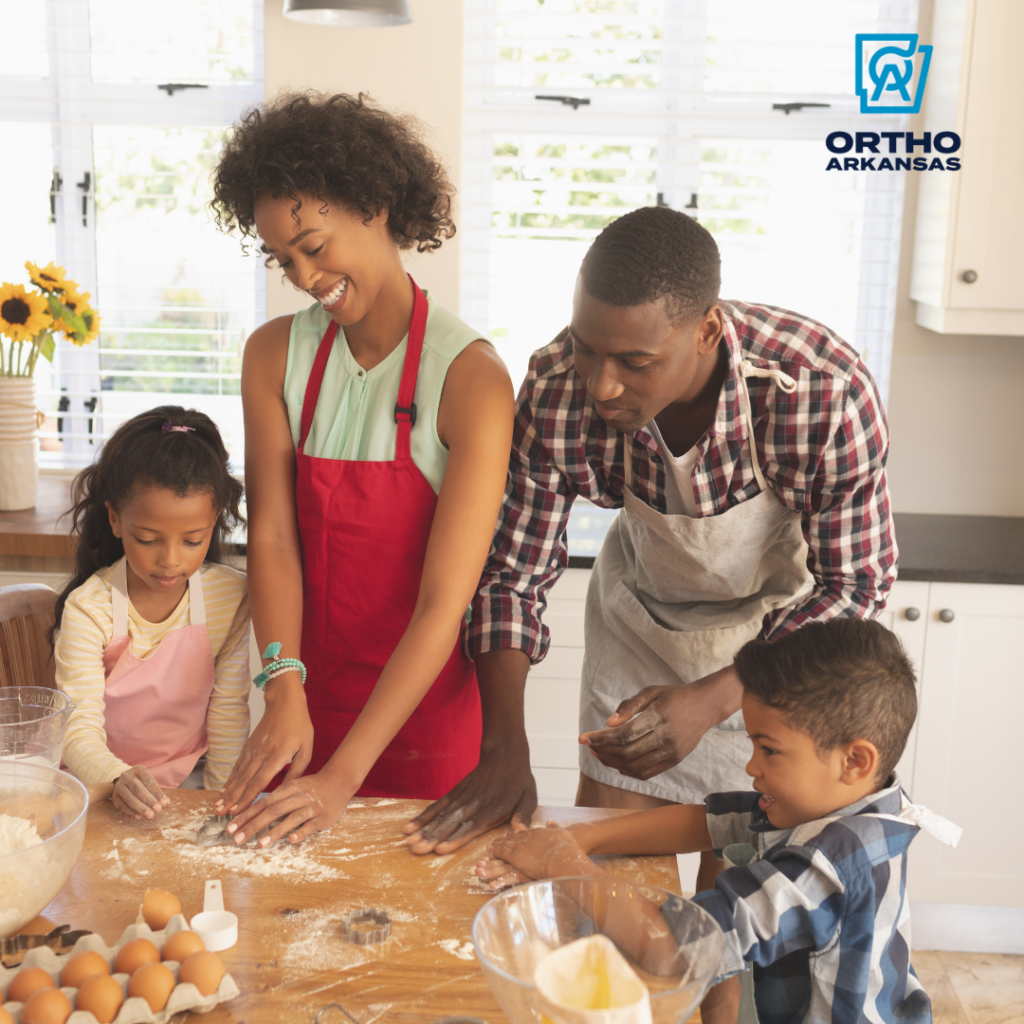 High angle view of family baking cookies in kitchen at home